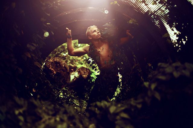 Man in Nature Looking Up Through Tunnel of Leaves - Download Free Stock Images Pikwizard.com