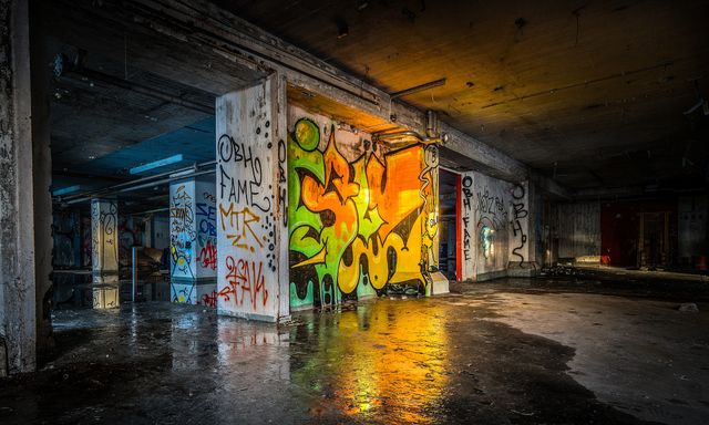 Graffiti-covered walls in abandoned industrial building - Download Free Stock Photos Pikwizard.com