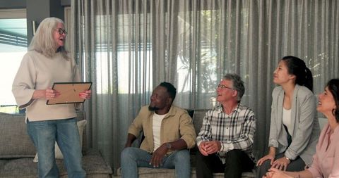 Diverse Group Therapy Session Celebrating Milestone Achievement