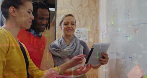 Diverse Business Team Collaborating on Digital Tablet