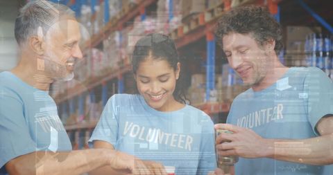 Diverse Volunteers Collaborating in Warehouse with Statistical Overlay - Download Free Stock Images Pikwizard.com
