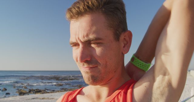 Man Stretching at Beach, Preparing for Morning Workout - Download Free Stock Images Pikwizard.com