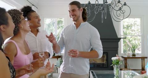 Elegant Indoor Wedding Reception with Guests Enjoying Drinks