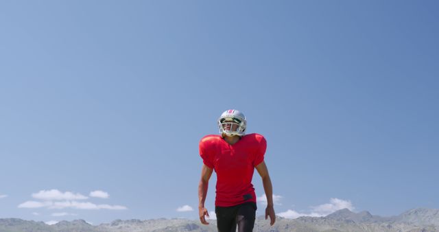 Football Player in Red Jersey and Helmet on Field - Download Free Stock Images Pikwizard.com