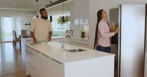 Modern Couple Preparing Breakfast in Spacious Kitchen