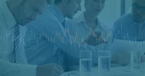 Diverse Team Analyzing Financial Data with Digital Graph Overlay