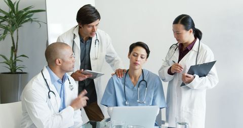 Diverse healthcare team collaborating on patient case