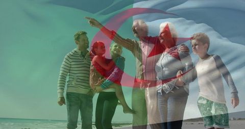 Multigenerational family walking on beach with algerian flag overlay