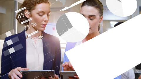 Businesswomen Using Tablets with Digital Interface Graphics