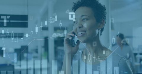 Smiling Businesswoman Analyzing Financial Data on Smartphone