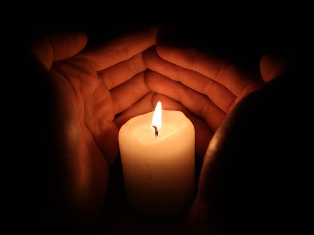 Hands Protecting Candle Flame in Darkness - Download Free Stock Photos Pikwizard.com
