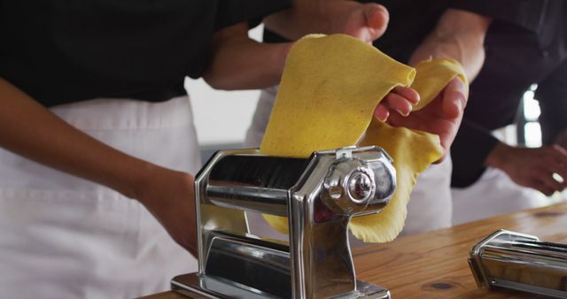 People Making Fresh Pasta with Manual Machine in Kitchen - Download Free Stock Images Pikwizard.com