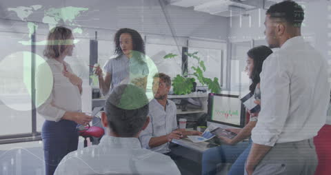 Diverse Business Team Analyzing Data with Digital Graphics Interface