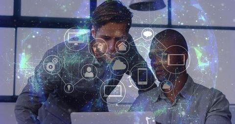 Business professionals analyzing laptop with holographic network overlay and data icons