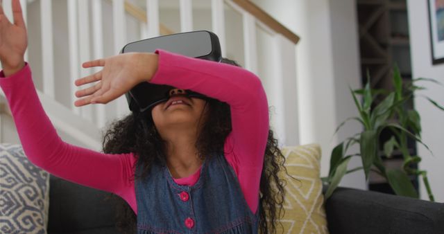 Joyful Girl Experiencing Virtual Reality at Home - Download Free Stock Images Pikwizard.com