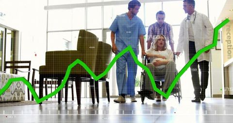 Healthcare team assisting pregnant woman in wheelchair with green growth graph overlay