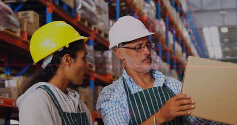 Warehouse Technicians Analyzing Inventory with Data Overlays