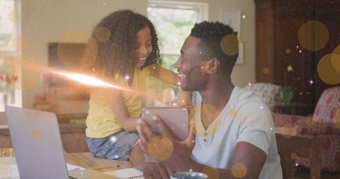 Happy Father and Daughter Using Tablet at Home
