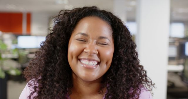 Confident African American Woman Smiling in Modern Office Space - Download Free Stock Images Pikwizard.com