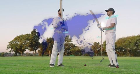 Holding bats, cricket partners standing on grass with global map overlay and teamwork