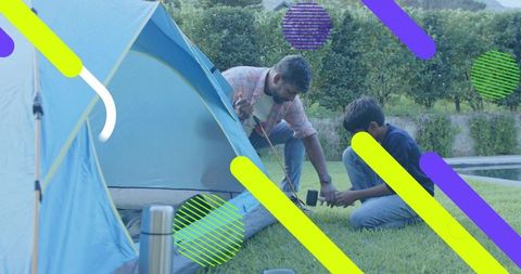 Dad and son assembling backyard tent, bonding through teamwork, outdoor camping