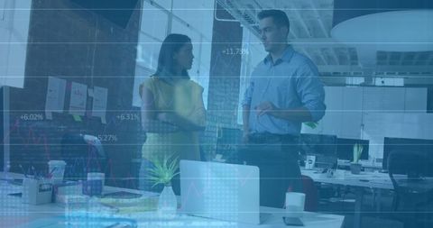 Professional discussion in modern tech-driven office