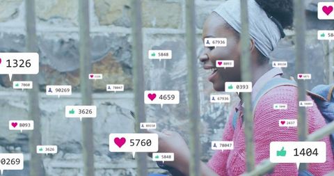 Engaged african american woman interacting on social media through smartphone