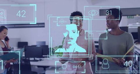 Women Collaborating with Facial Recognition Technology in Modern Office