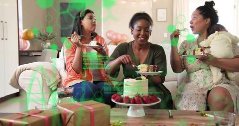 Women celebrating at home cutting cake and sharing dessert with gifts and infant