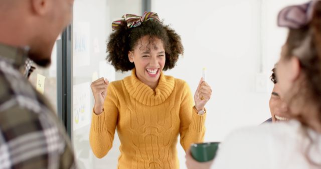 Ecstatic Young Woman Celebrating Success in Group Meeting - Download Free Stock Images Pikwizard.com