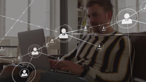 Digital Networking Icons Overlaid on Focused Businessman