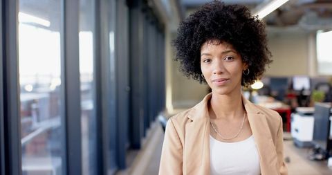 Confident Young Woman in Modern Office Environment