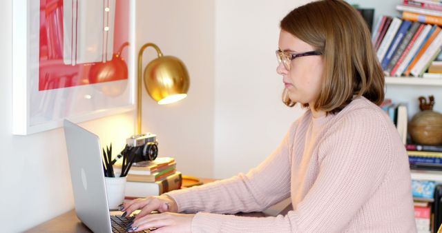 Woman using a laptop at home