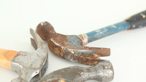 Old and Worn Hammers on White Background