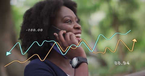 African American Woman Analyzing Data on Smartphone Outdoors