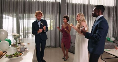 Bridal Party Celebration with Sparklers at Wedding Reception Indoors