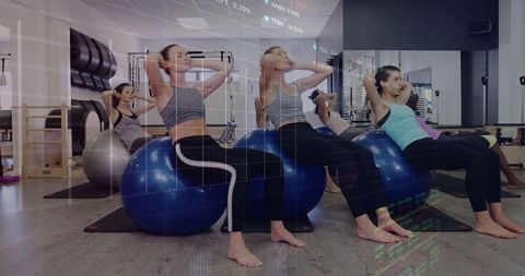 Group Exercise Class with Stability Balls in Fitness Studio