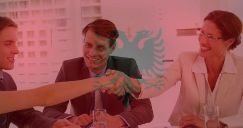 Business leaders shaking hands in boardroom with double-headed eagle emblem overlay