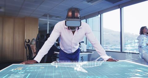 african american man explores 3d plane model with vr headset in office - Download Free Stock Images Pikwizard.com