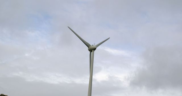 Modern Wind Turbine against Cloudy Sky for Renewable Energy - Download Free Stock Images Pikwizard.com