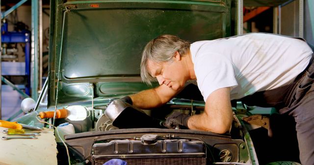 Auto Mechanic Fixing Engine of Classic Car in Workshop - Download Free Stock Images Pikwizard.com