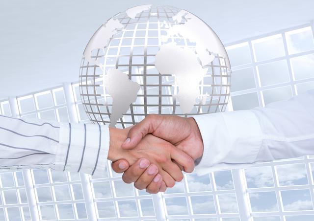 Digital composition showcasing a business handshake in front of a glowing silver globe. Represents international business, partnerships, and successful collaboration. Ideal for use in corporate presentations, business websites, advertising for global companies, and media depicting professional environments.