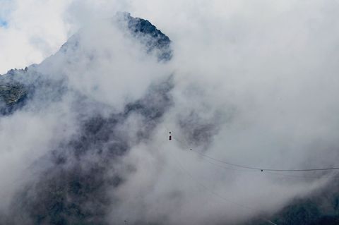 Dramatic Mountain Peak Shrouded in Mystical Fog