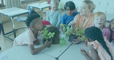 Teacher guiding diverse children exploring potted seedlings, hands-on plant lesson