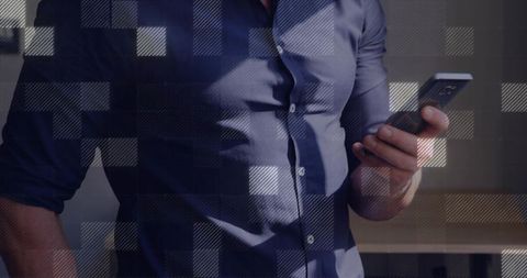 Businessman Holding Smartphone Overlaid with Digital Grid