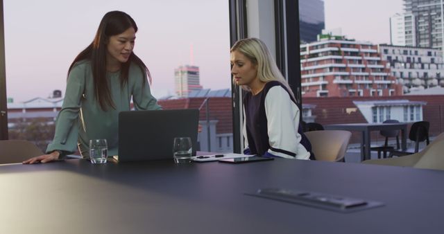 Two Businesswomen Discussing Project in Modern Office with City View - Download Free Stock Images Pikwizard.com