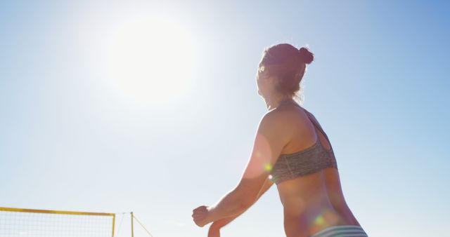 Woman at Beach Playing Volleyball Enjoying Sunny Weather - Download Free Stock Images Pikwizard.com