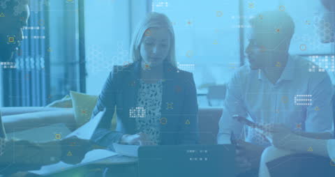 Business Team Analyzing Data with Technology Overlay