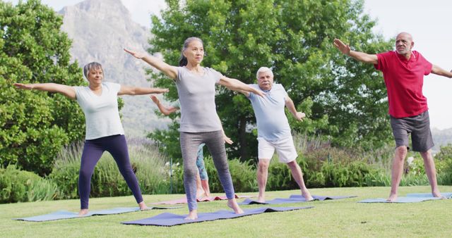 Older adults performing yoga outdoors, encouraging a healthy and active lifestyle. Ideal for promoting senior fitness programs, wellness retreats, or retirement community activities. Can also be used for illustrating articles on healthy aging, physical well-being, or group exercise routines for elderly individuals.