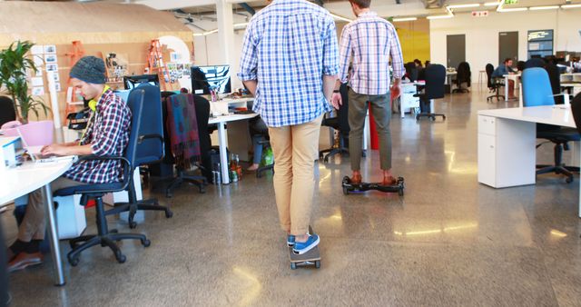 Modern Office with Young Professionals on Skateboards and Hoverboards - Download Free Stock Images Pikwizard.com